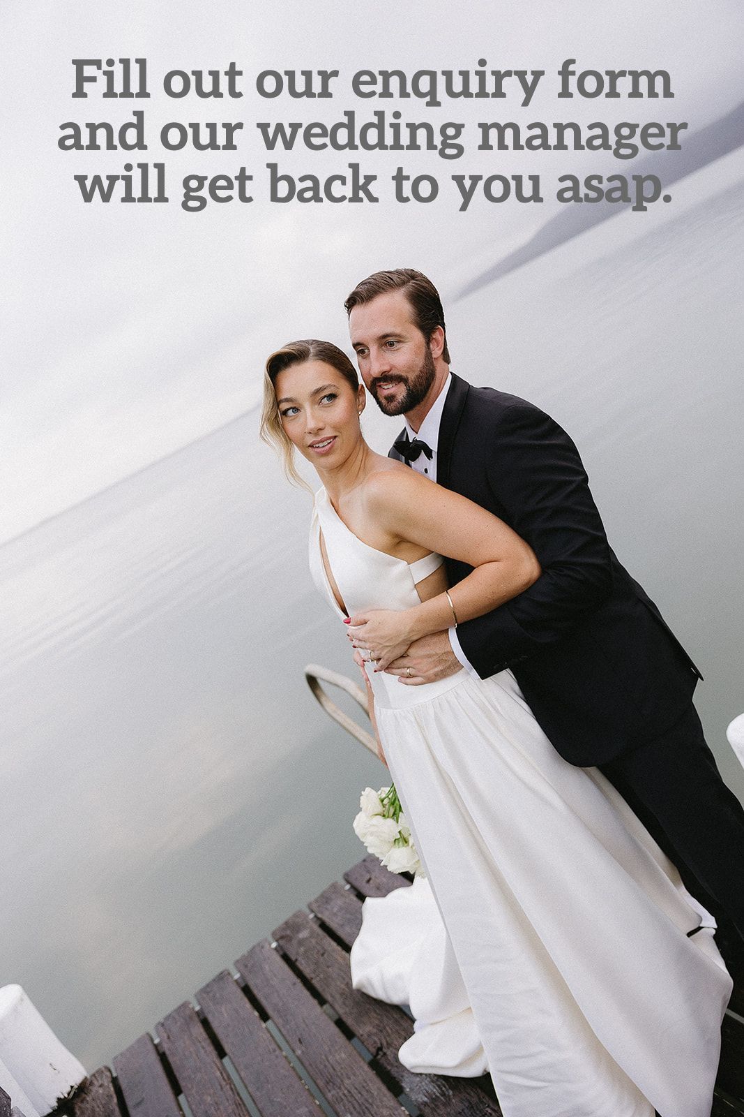A bride and groom are posing for a picture on a dock.