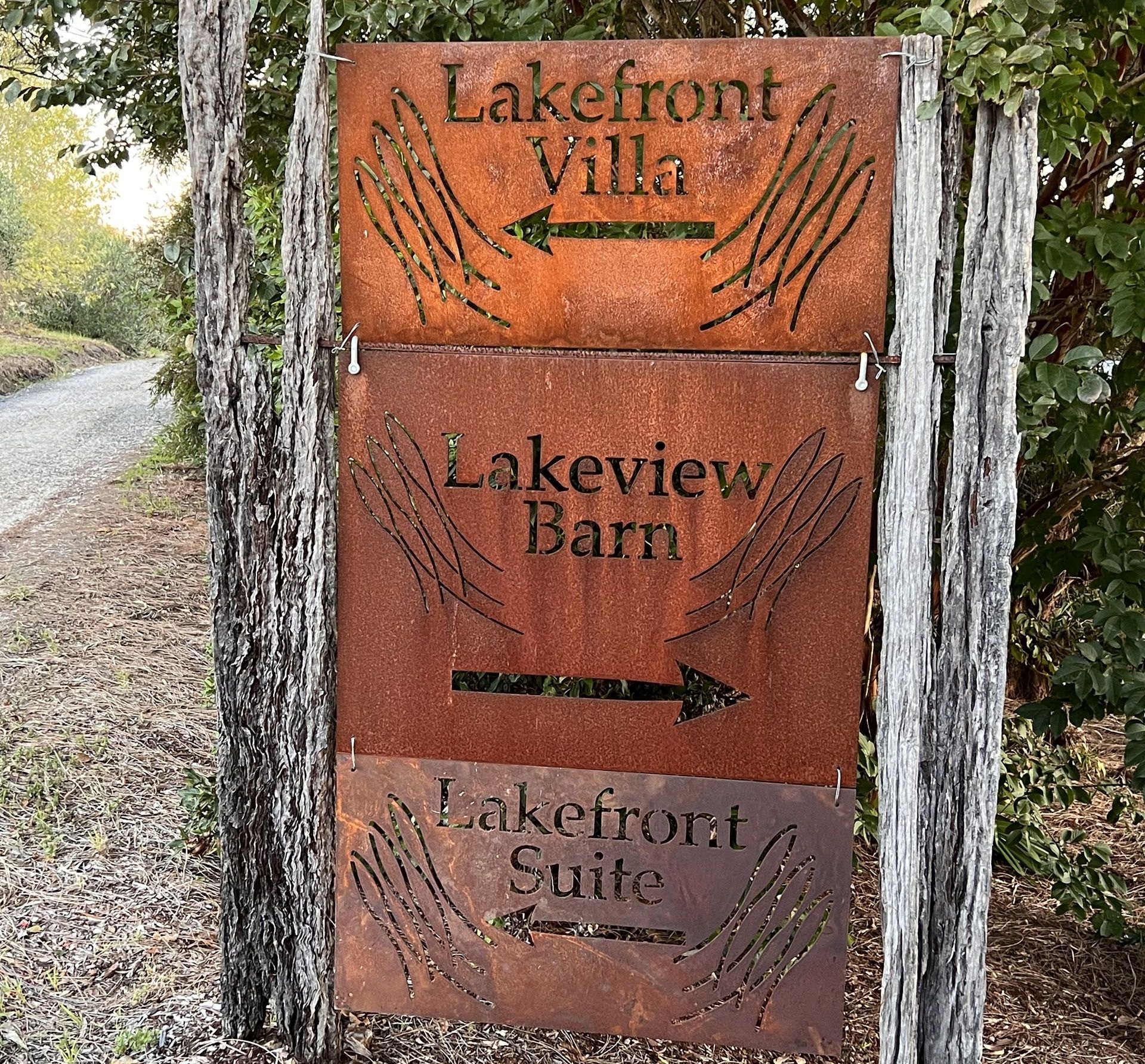 A rusty sign for lakefront villa lakeview barn and lakefront suite