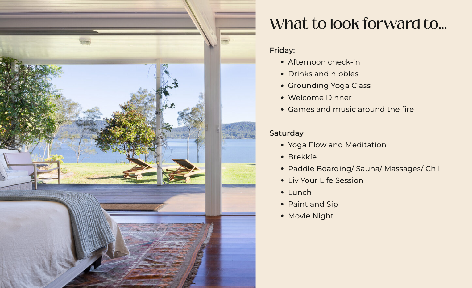 A bedroom with a large window overlooking a lake.