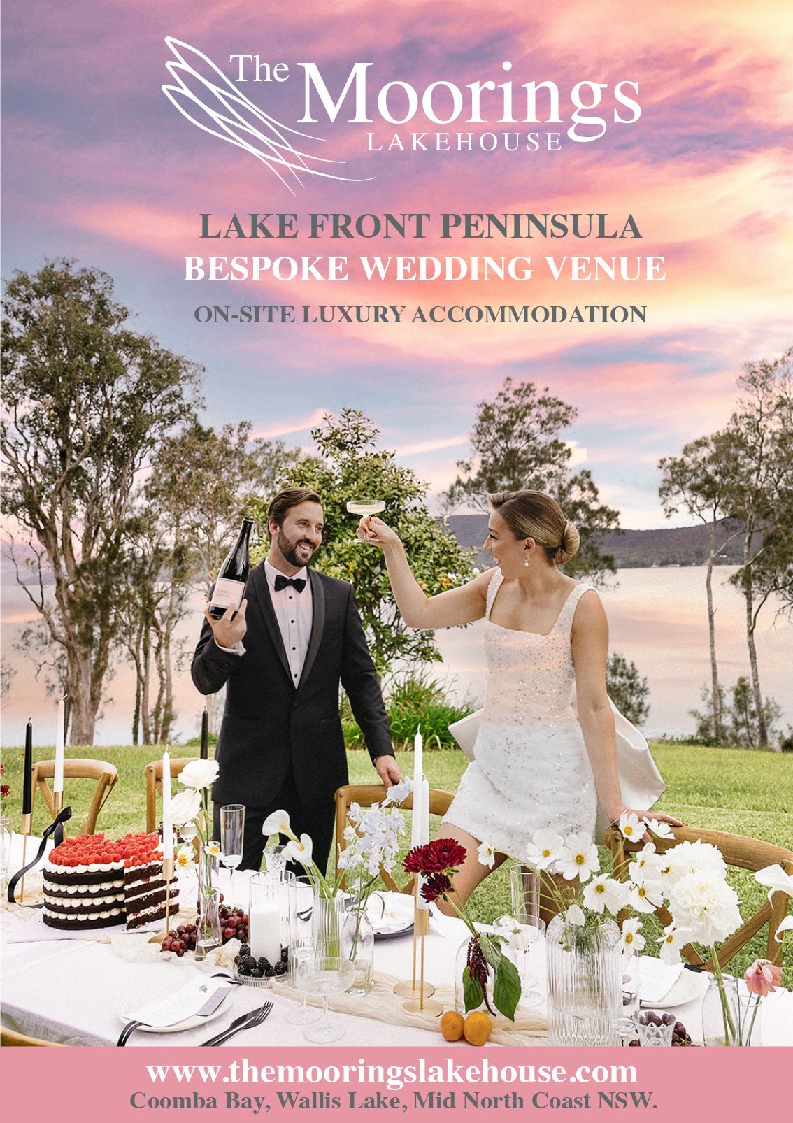 A bride and groom are standing next to each other at a wedding table.