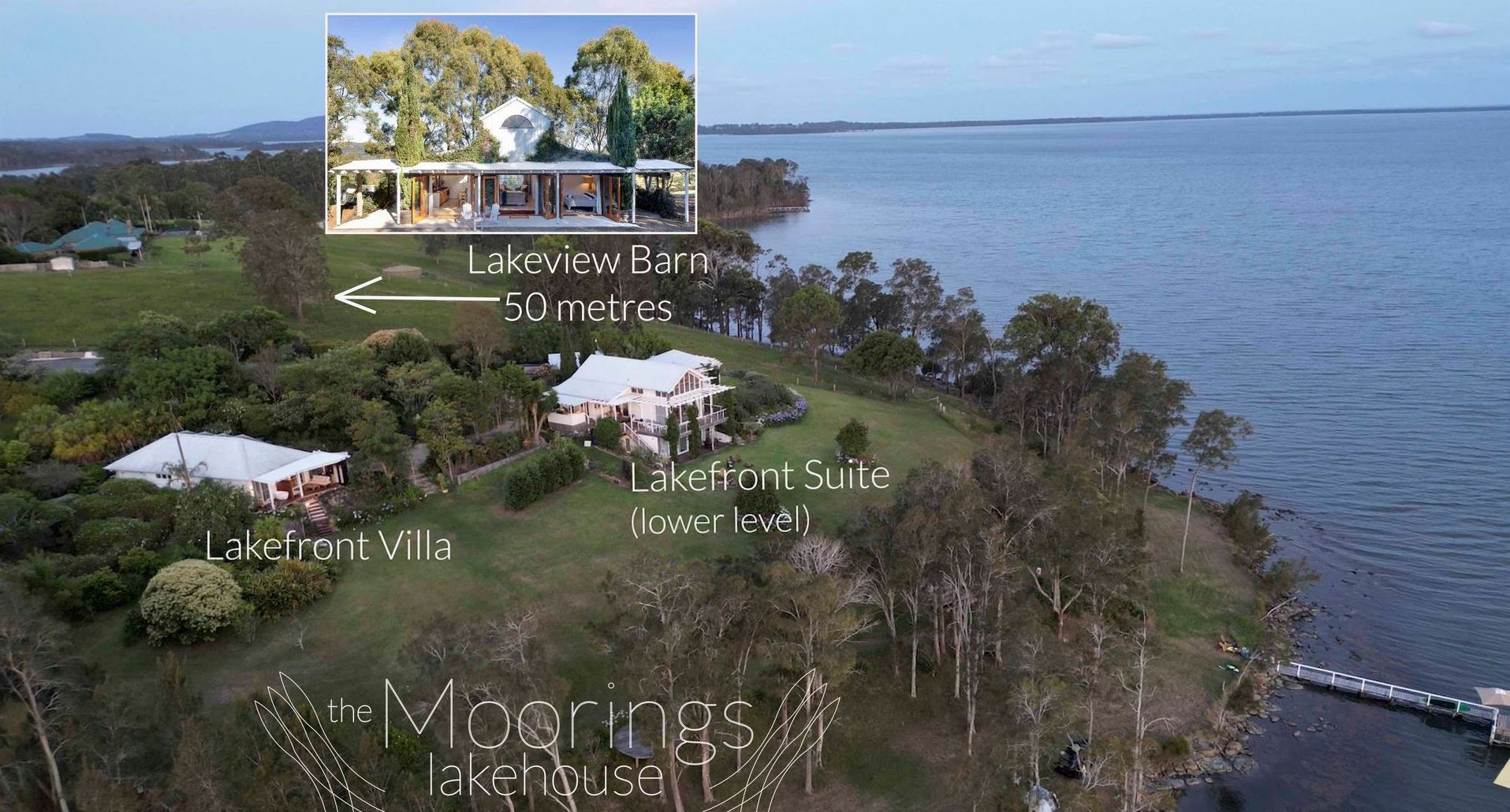 An aerial view of a house on a hill overlooking a body of water.