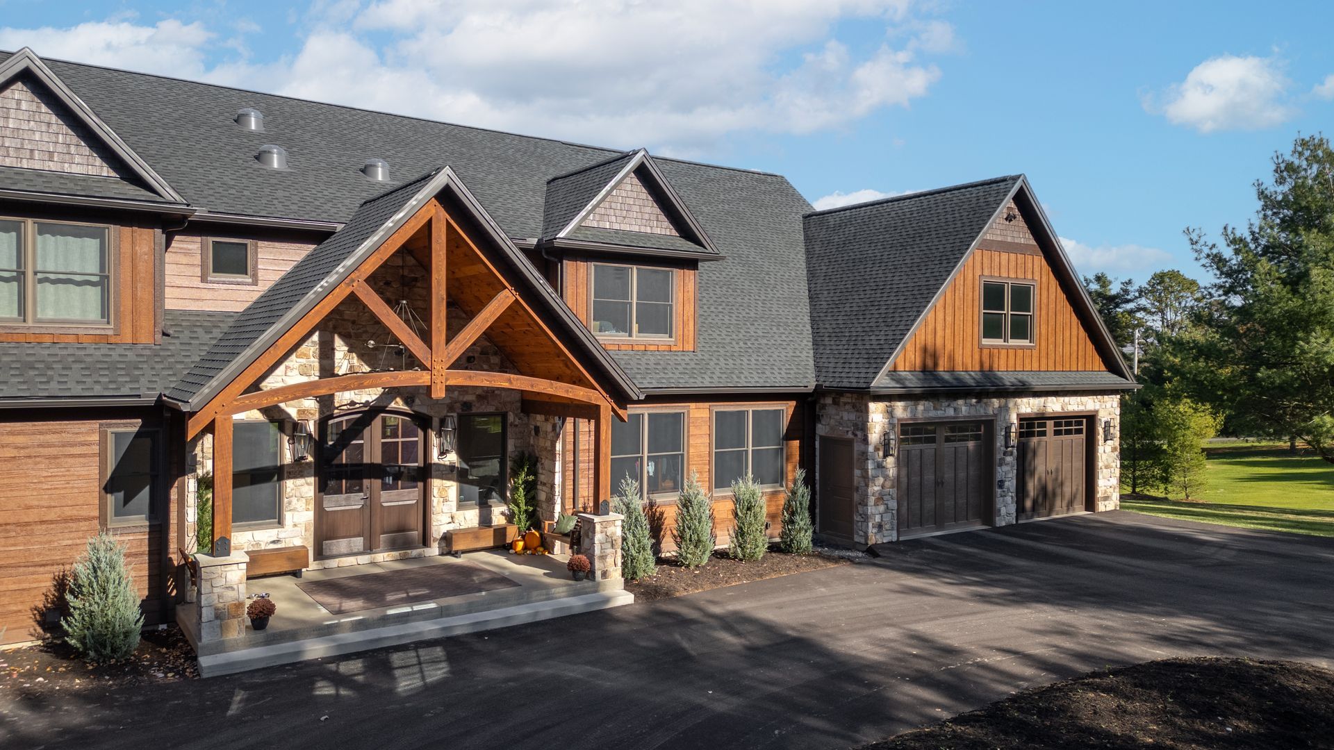 Custom timber frame home in State College, PA by local Amish custom home builder.