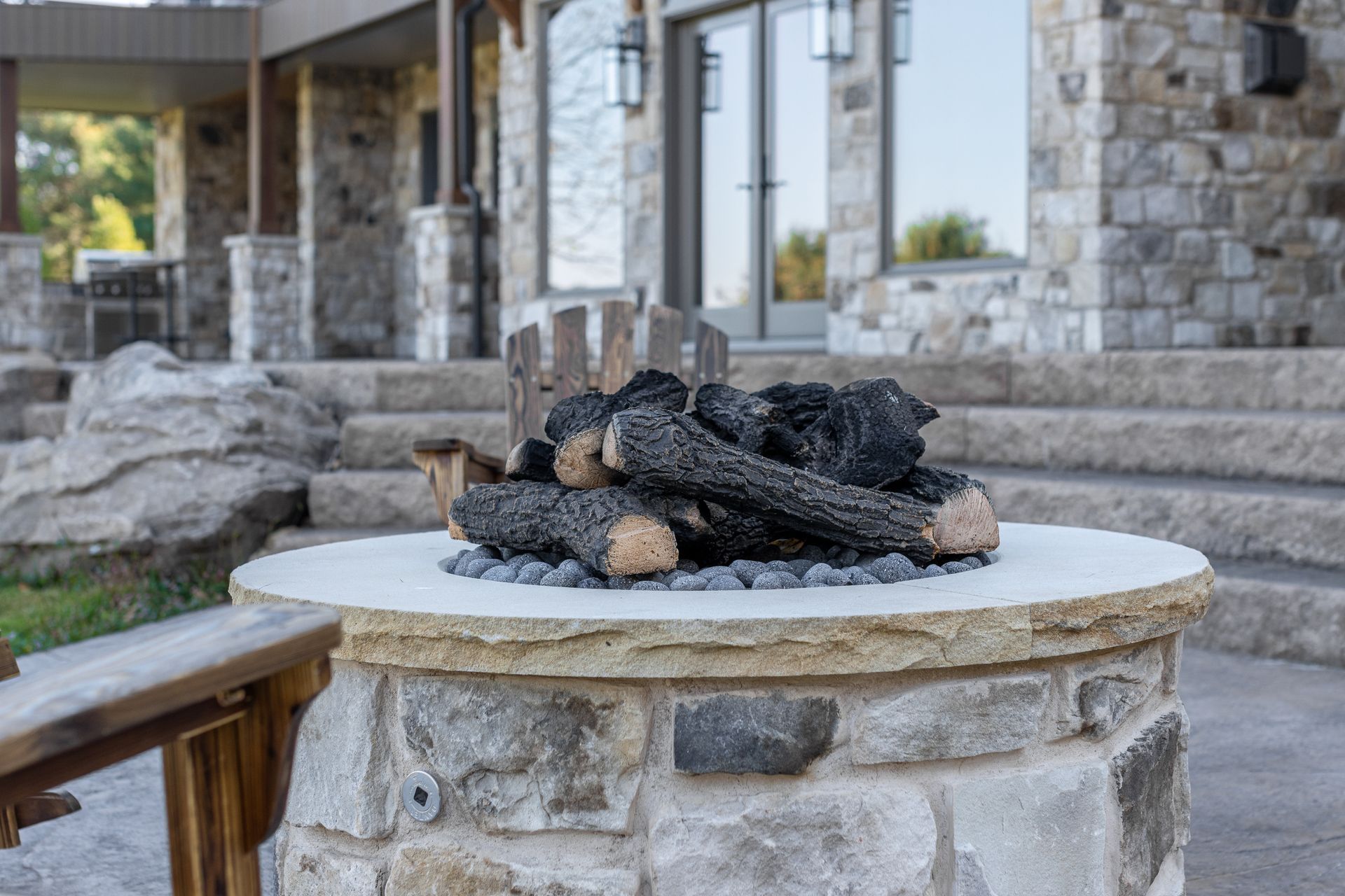Custom home in State College, PA. back yard patio with firepit custom stone work