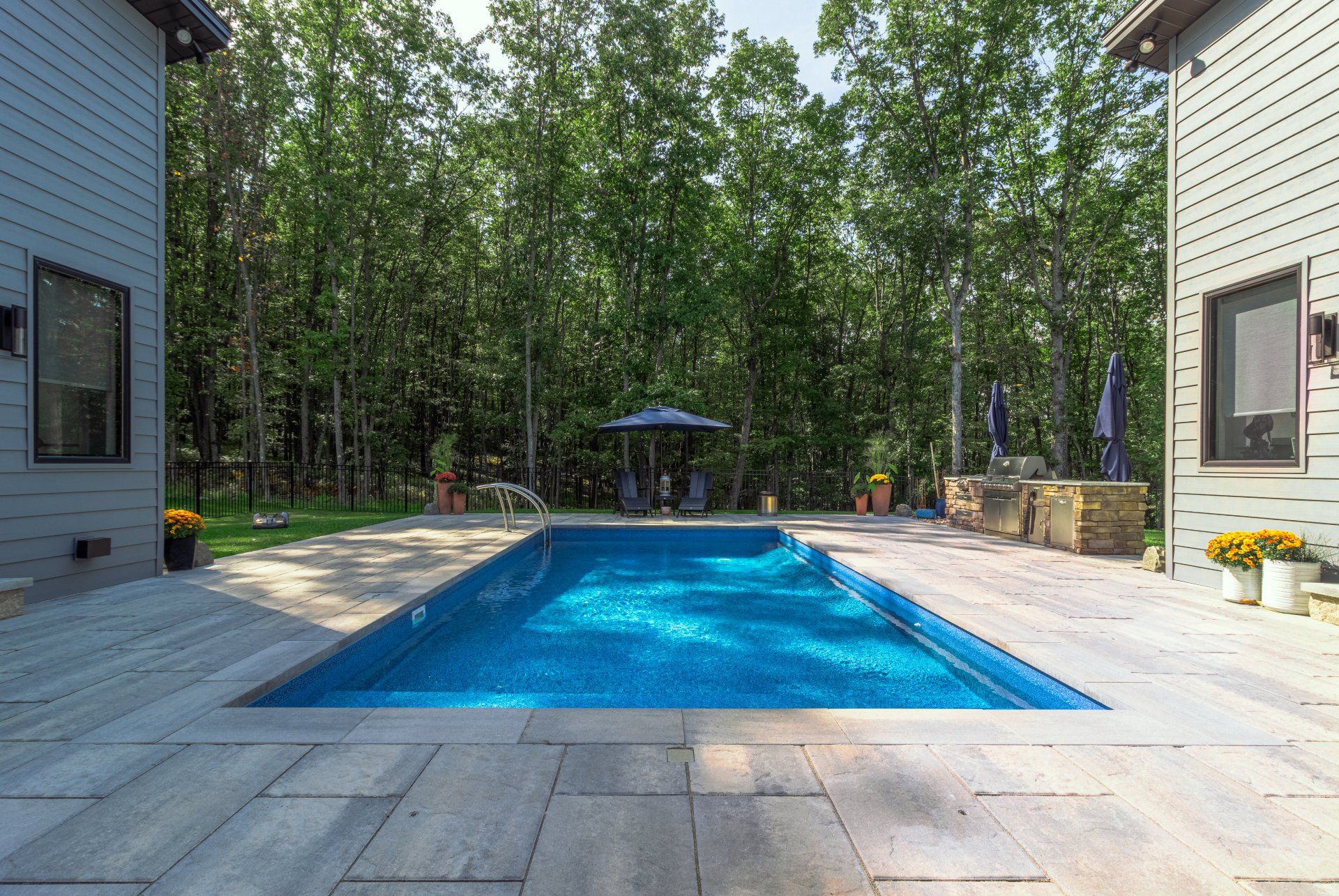Private backyard patio and pool at a custom home State College, PA