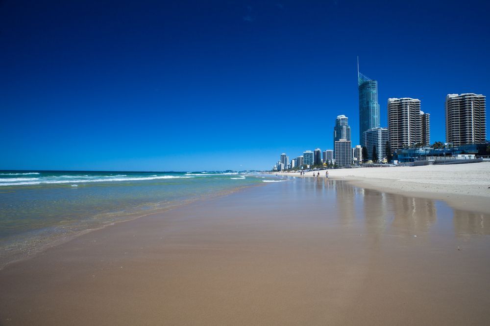 A Beach with A City Skyline in The Background — PEPS Machinery Services In Gold Coast, QLD