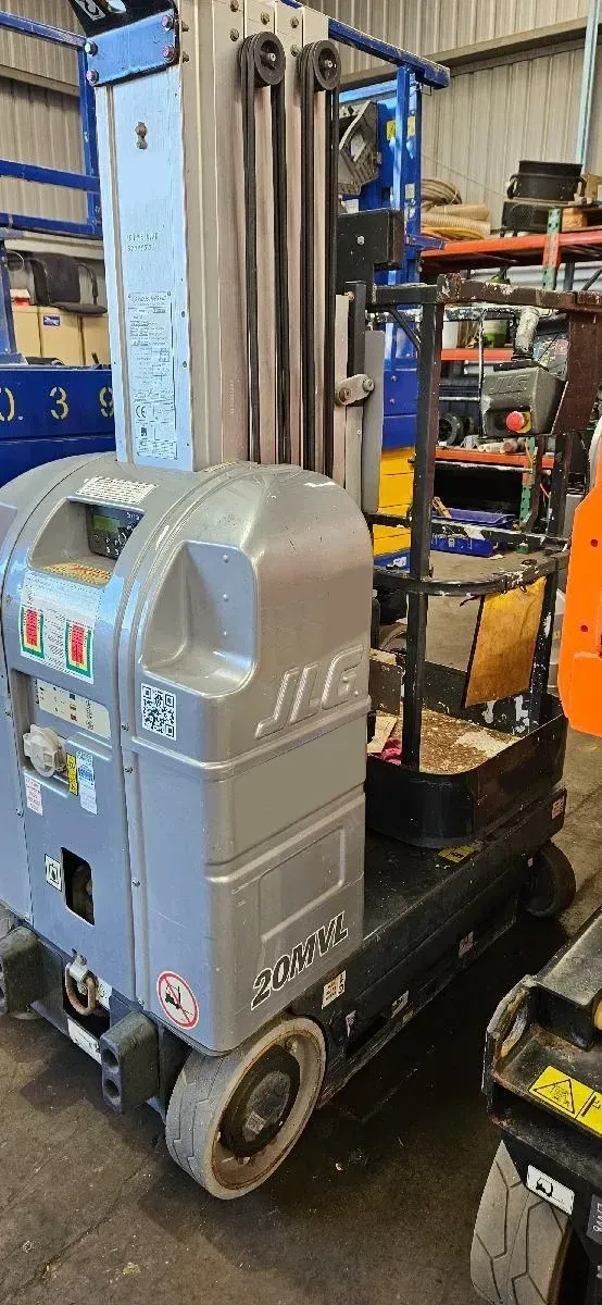 A Forklift Is Parked in A Garage Next to A Warehouse — PEPS Machinery Services In Bethania, QLD