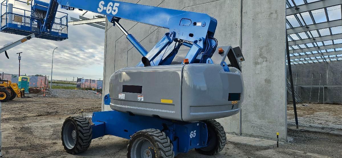Two Blue Aerial Lifts Are Parked on The Side of The Road — PEPS Machinery Services In Bethania, QLD