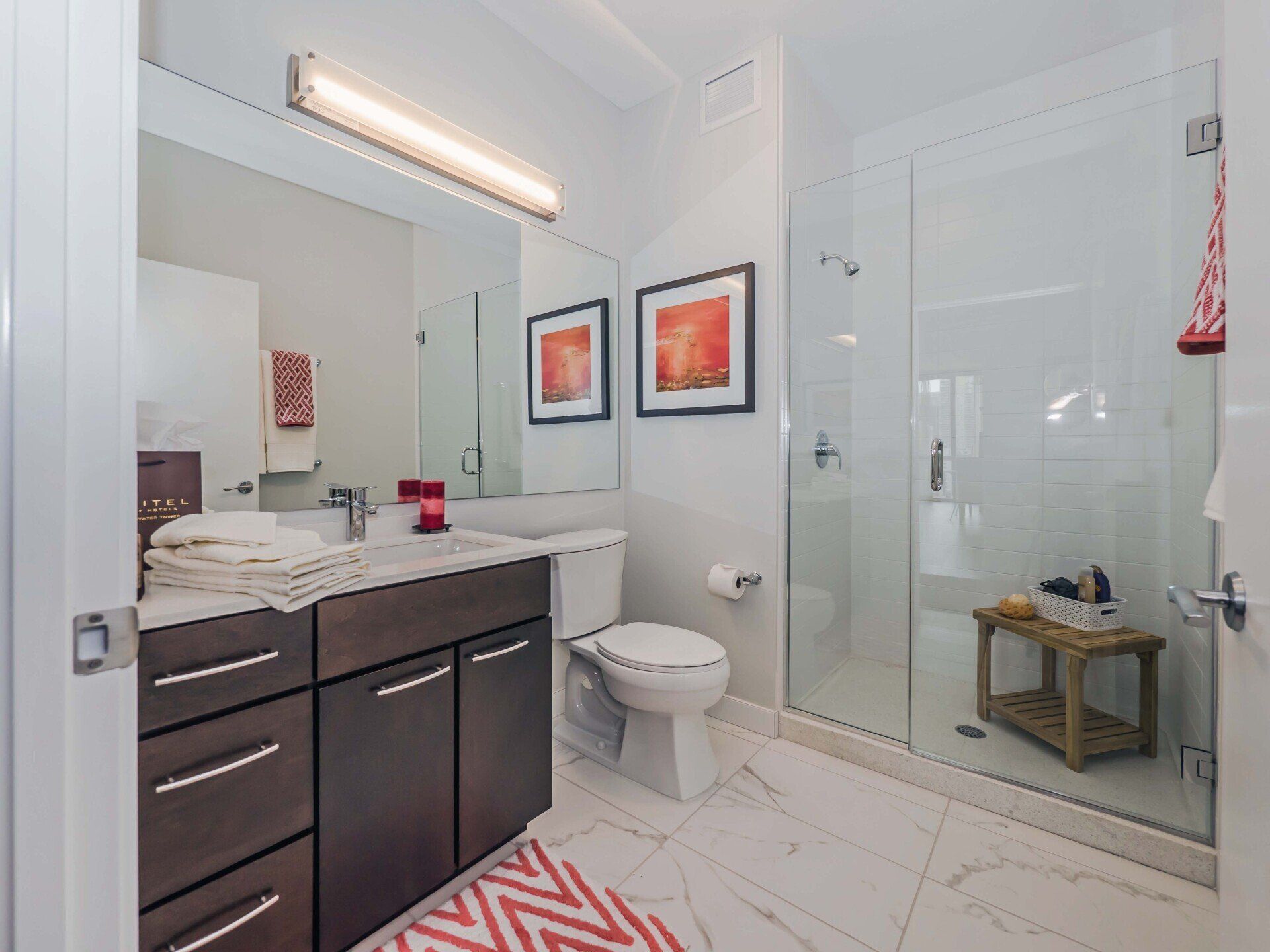 Modern bathroom with glass shower doors at State & Chestnut
