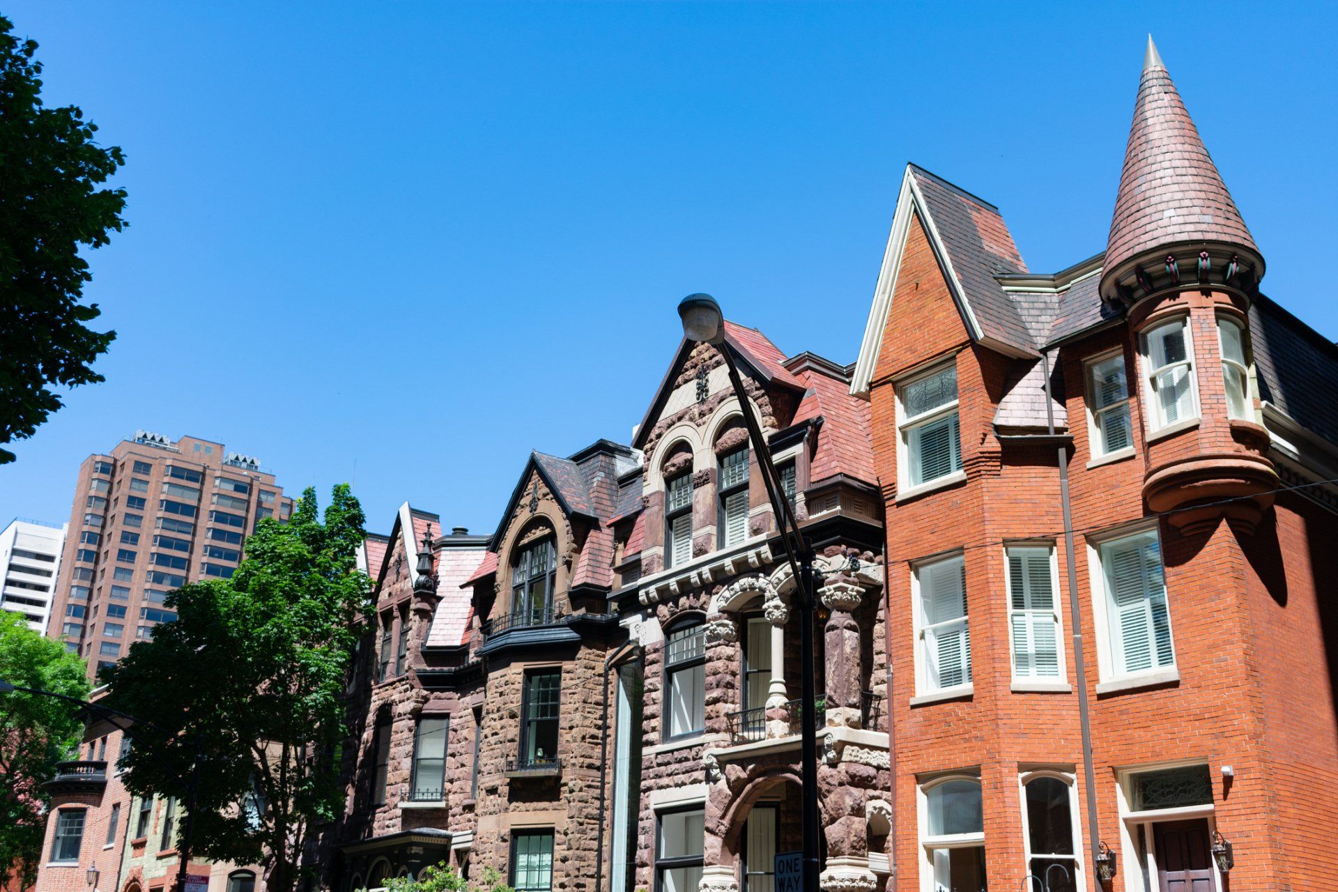 A row of brick houses with a tower in the middle