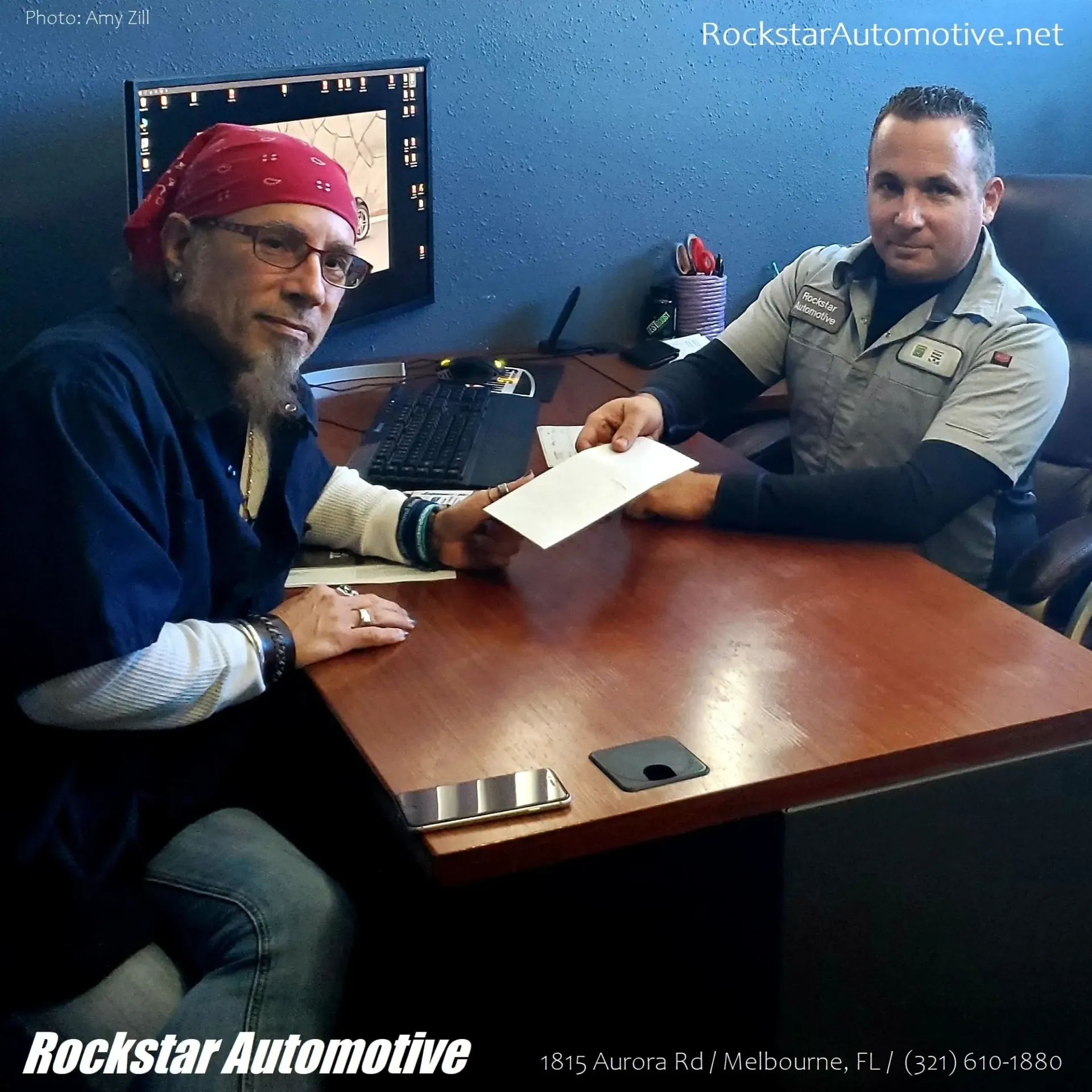 The Owner of  Rockstar Automotive with a Client in Melbourne, FL