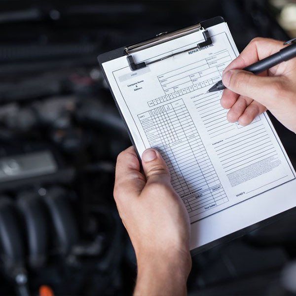 Mechanic Repairman Inspecting Car — Logbook Servicing in New Lambton, NSW