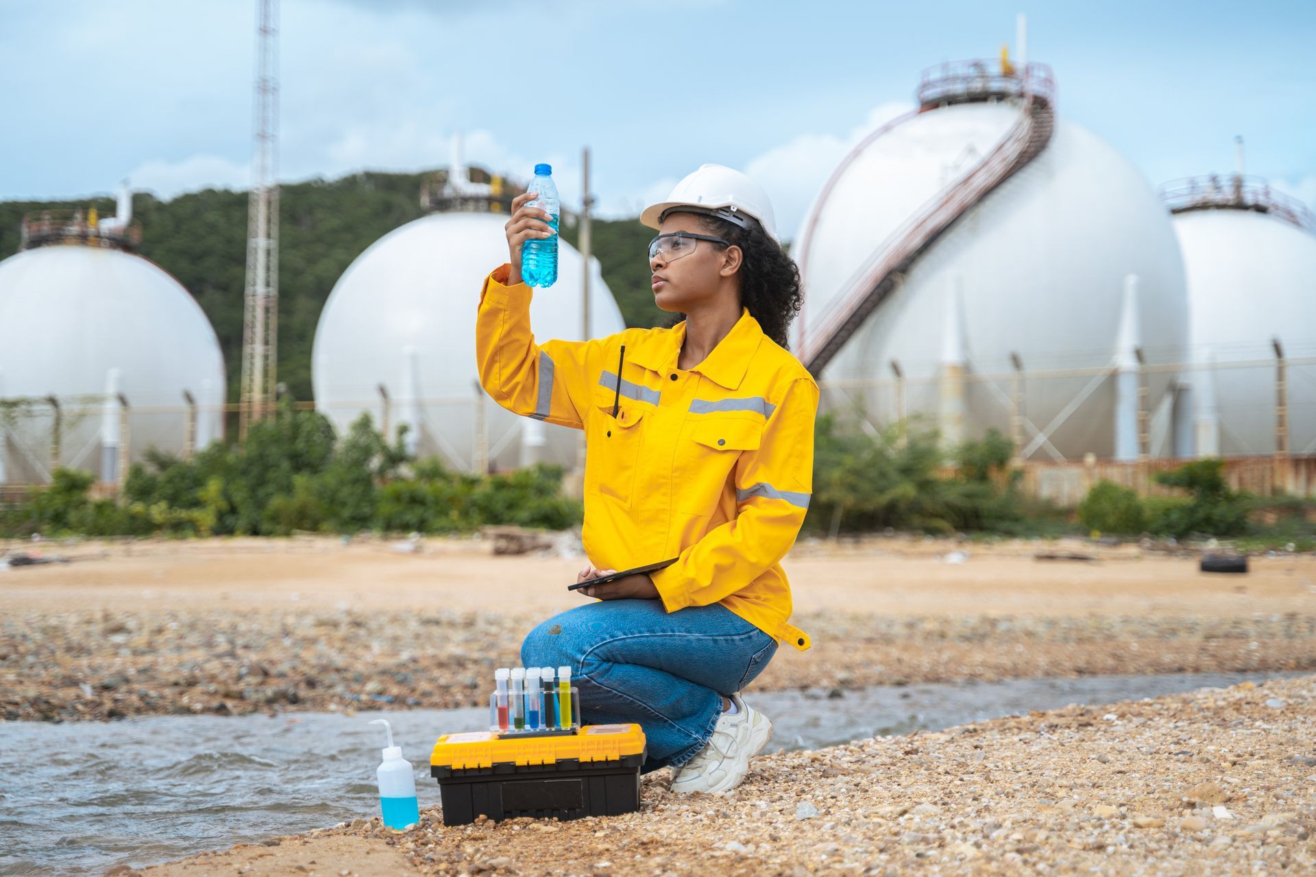 A woman is collecting water samples.