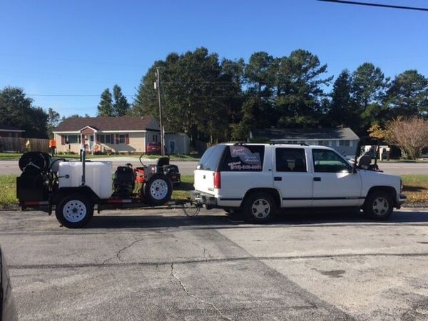 Company car and plumbing equipment - Clogged Drain in Swansboro, NC