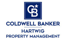 Coldwell Banker Hartwig Property Management logo in blue and white