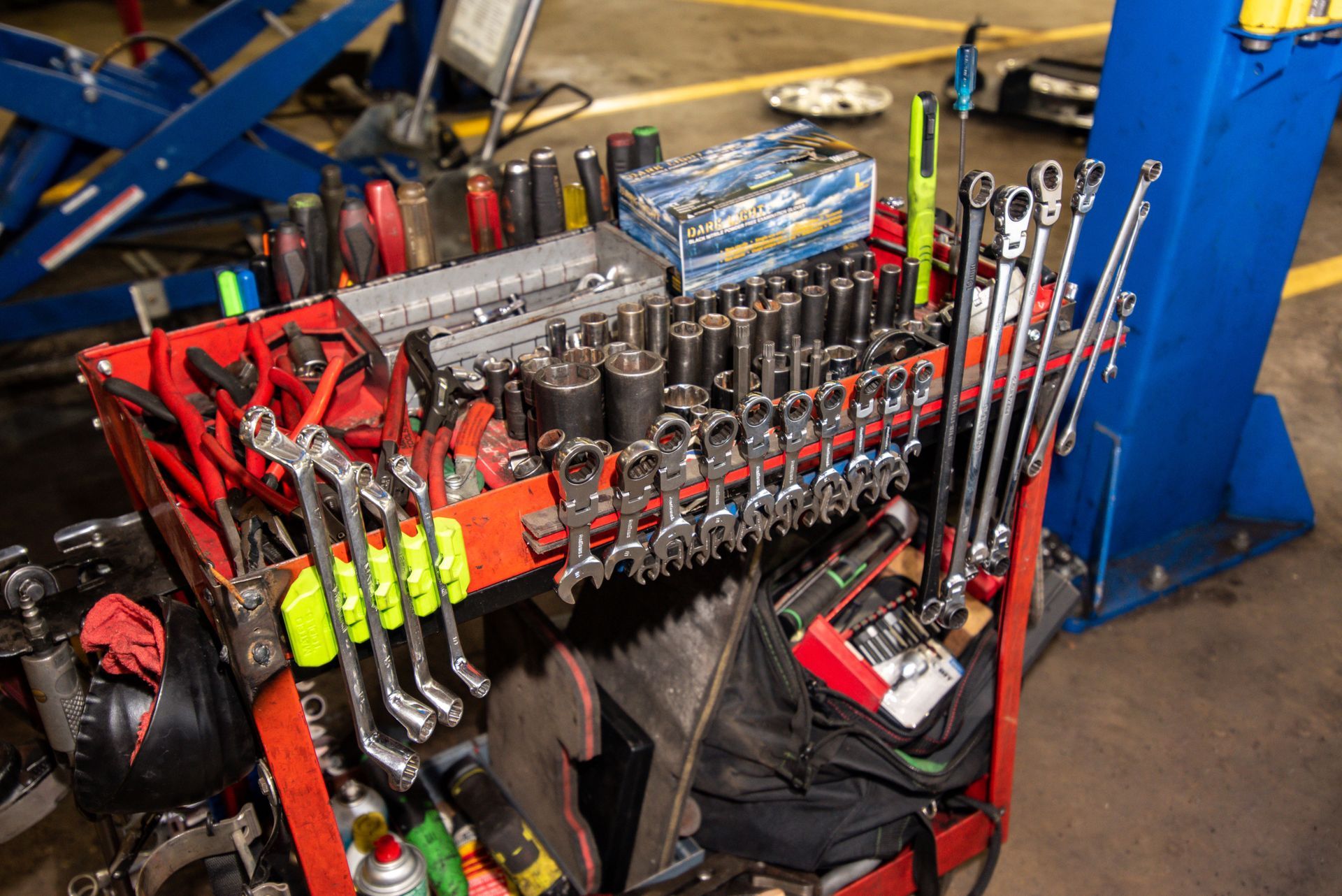 Red tool cart filled with wrenches, sockets, and other automotive tools in a workshop | Freestate Auto & Truck Service
