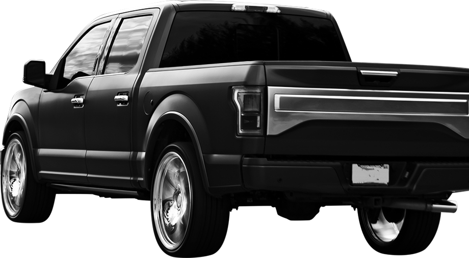 Black pickup truck, rear view, chrome wheels, tinted windows | Freestate Auto & Truck Service