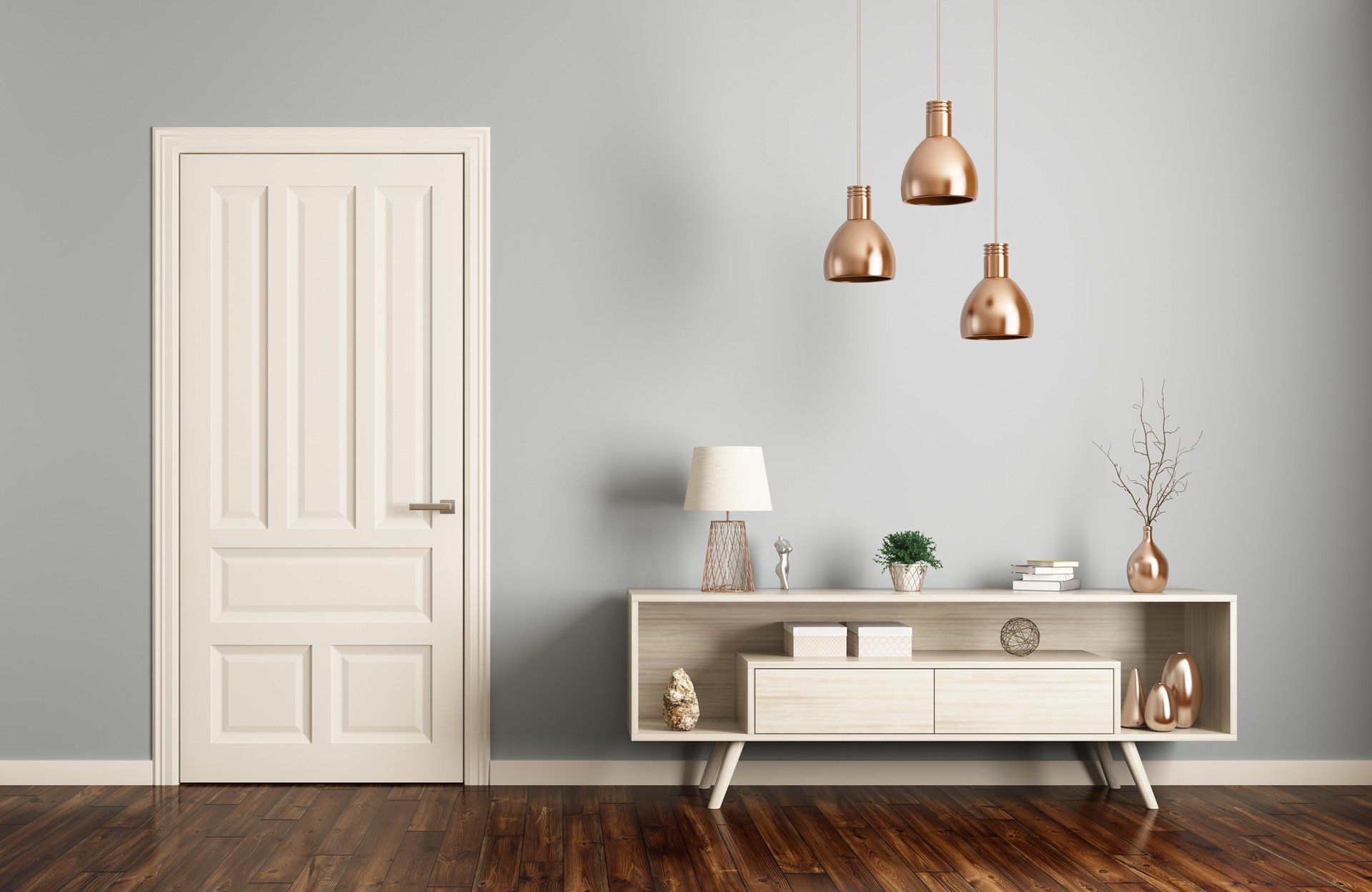 Minimalist living room with white door, white cabinet, copper pendant lights, and wooden floor