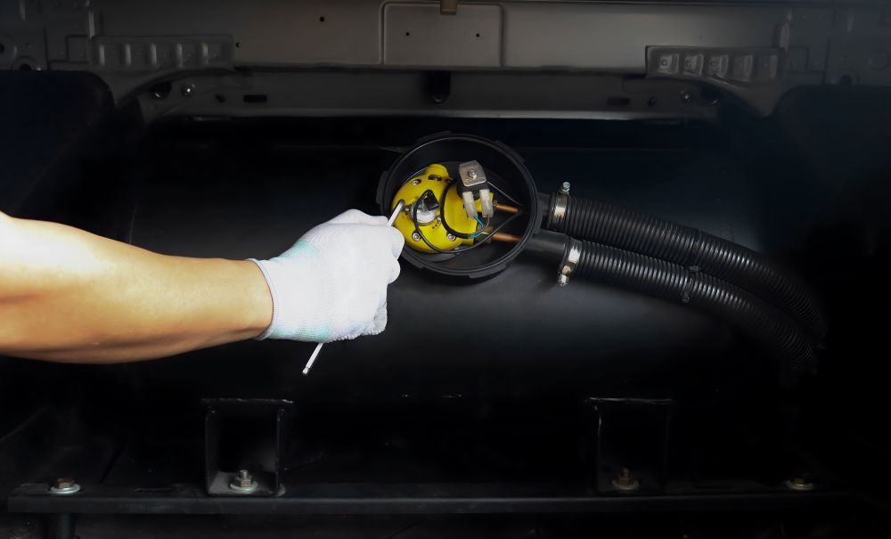 A Person Is Working on A Gas Tank in A Car — Raff's Advanced Automotive P/L in Fairy Meadow, NSW