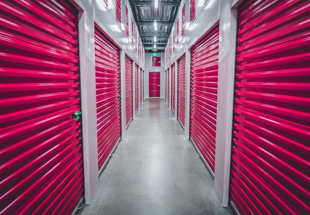 Contractors organize tools inside storage unit.
