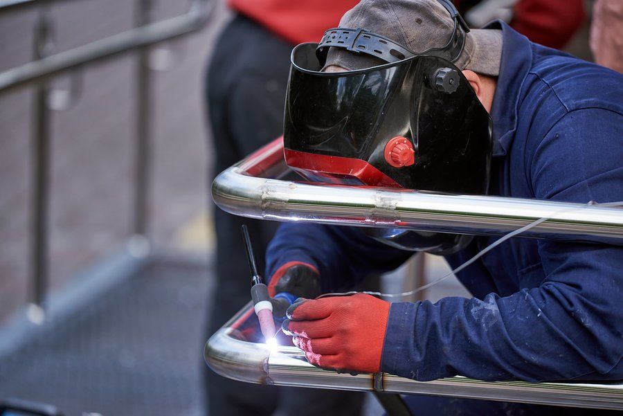 welder welding the tubular stainless steel