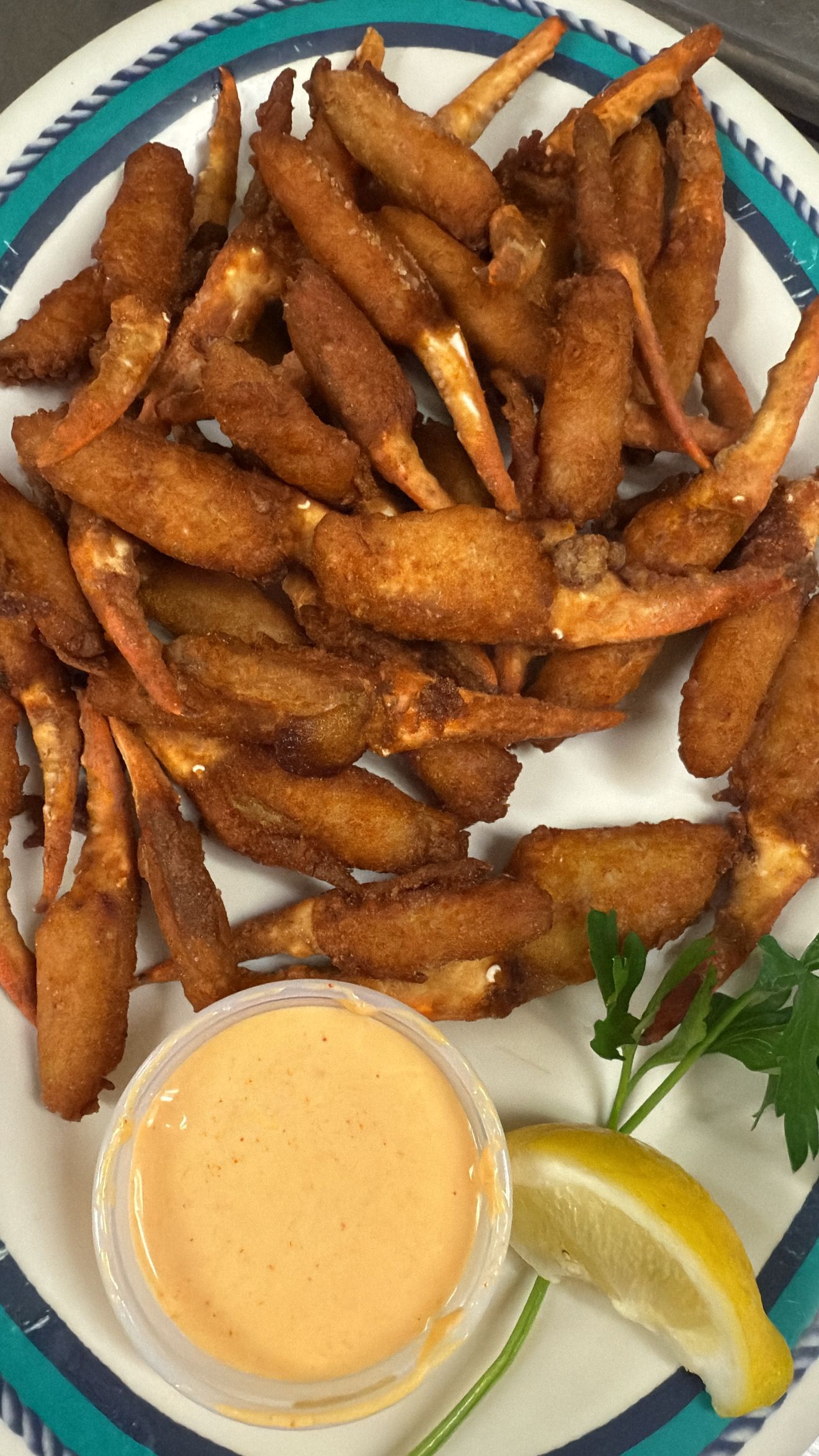Fried crab claws with dipping sauce and lemon. At High Tide Harry's