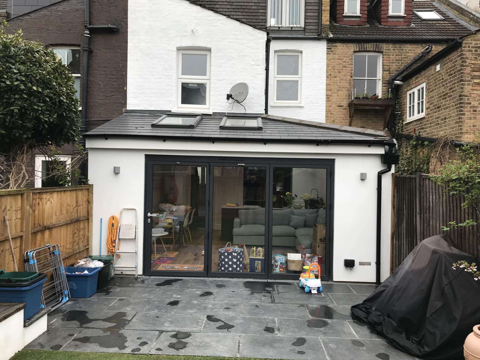 The back of a house with a large sliding glass door
