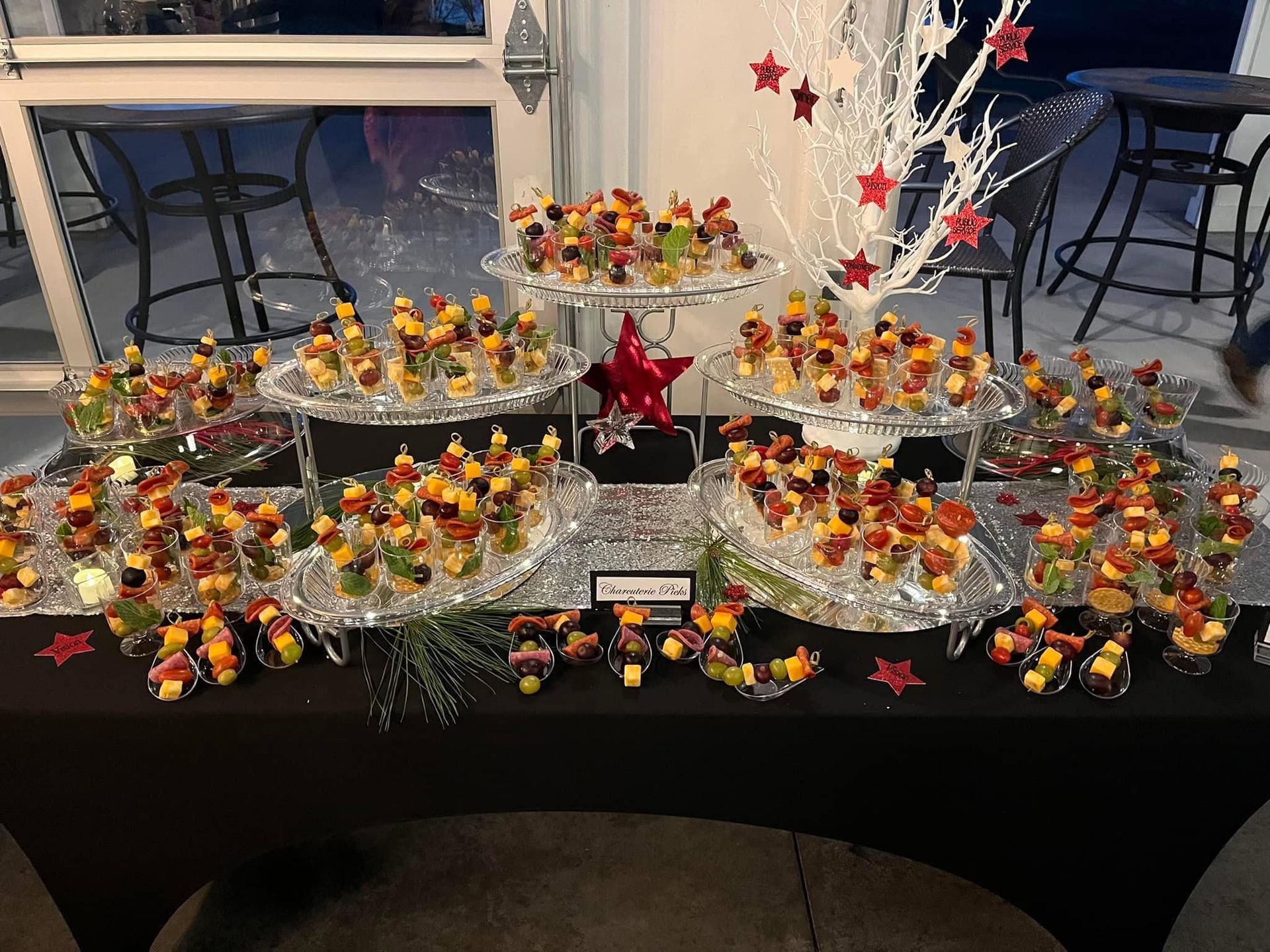 A table topped with a variety of fruit skewers.