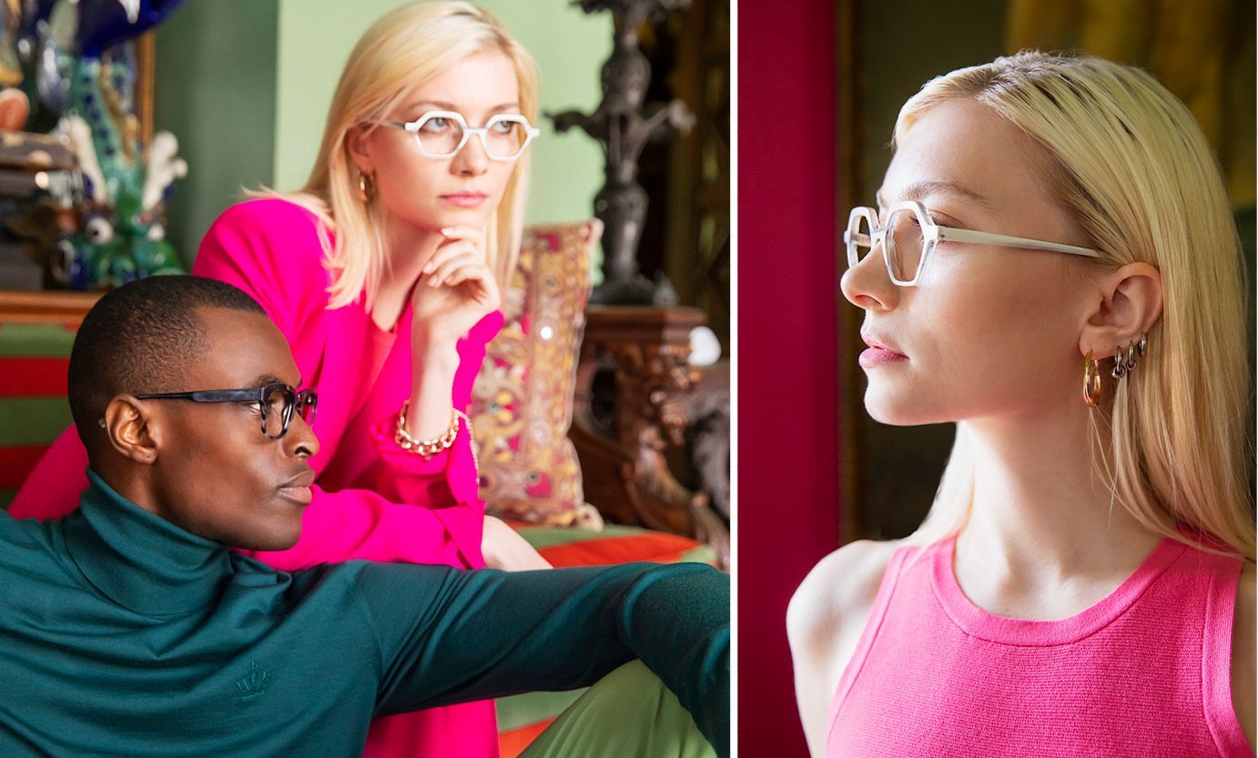 A man and a woman wearing glasses are sitting next to each other on a couch.