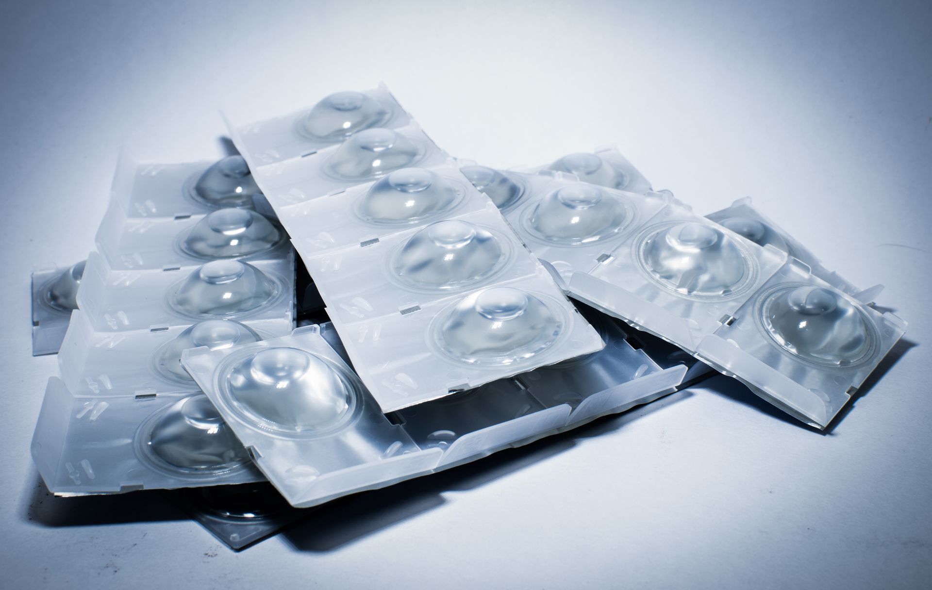 A pile of contact lenses are stacked on top of each other