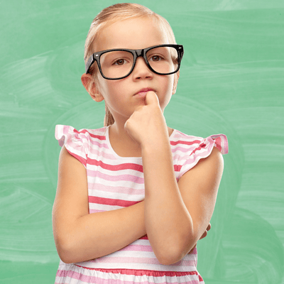A little girl wearing glasses is thinking with her hand on her chin.