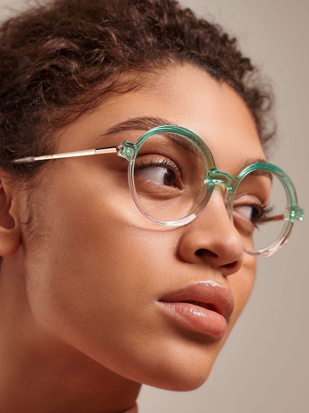 A close up of a woman wearing glasses.