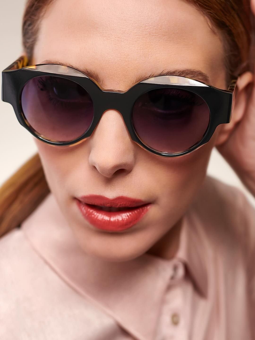 A woman wearing sunglasses.