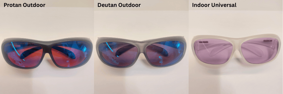 Three pairs of enchroma sunglasses with different lens colors on a white surface.