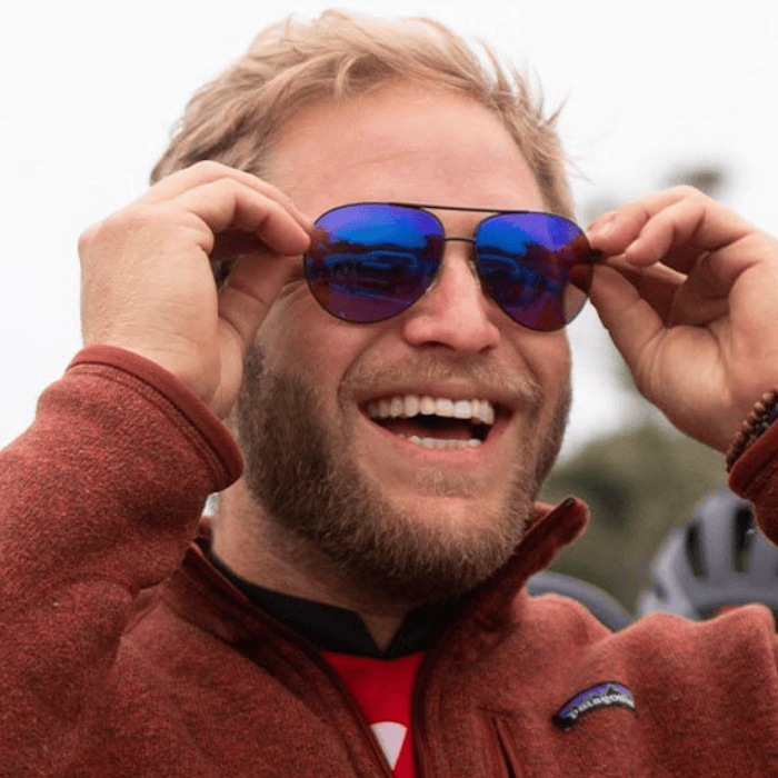 Man wearing enchroma sunglasses smiling