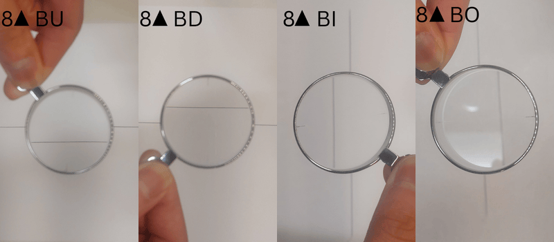 Four magnifying glasses with prism showing how lines appear through them.