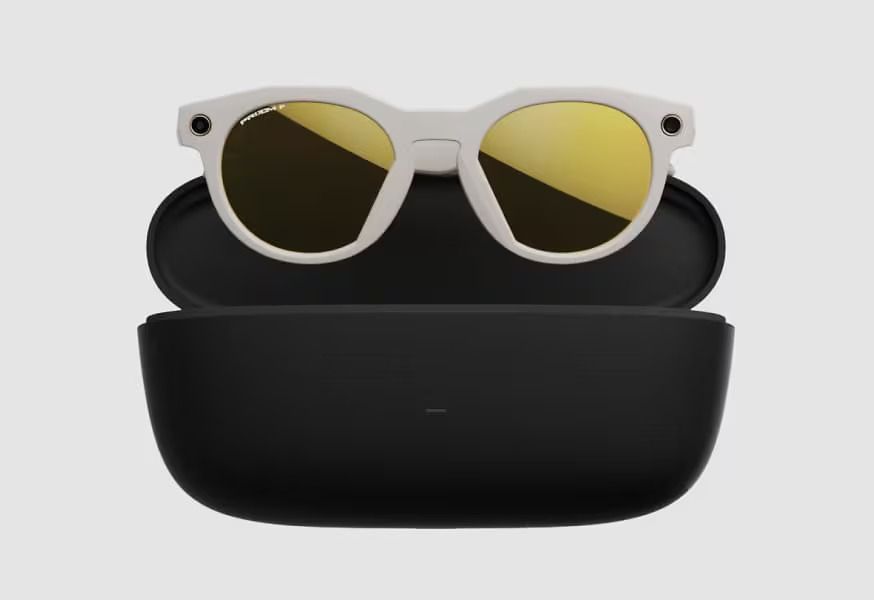 A pair of meta oakley sunglasses sitting on top of a black case.