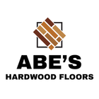 ABE'S Hardwood Floors logo with a brown and beige wood tile graphic on a black frame