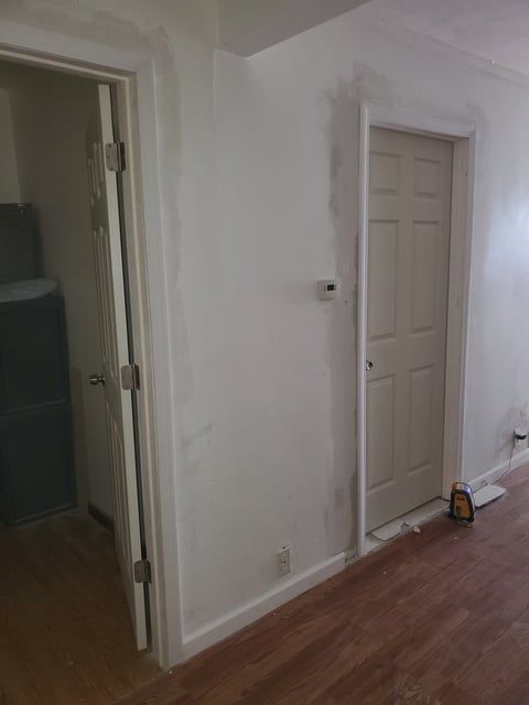There is a door in the middle of the room.