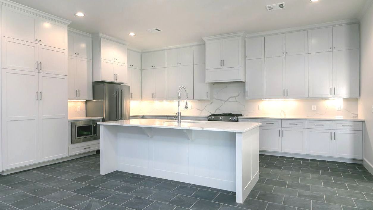 There is a large island in the middle of the kitchen.