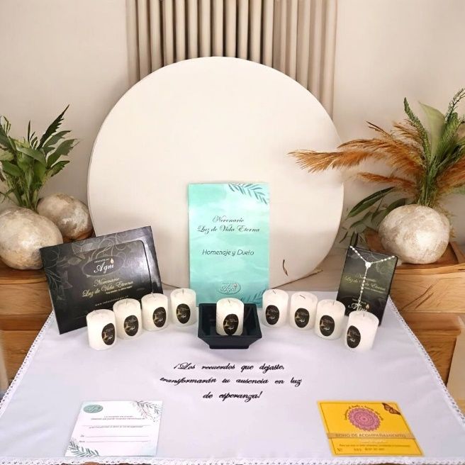 Piedras pintadas dispuestas alrededor de un colorido diseño de azulejos sobre un suelo de baldosas de terracota.