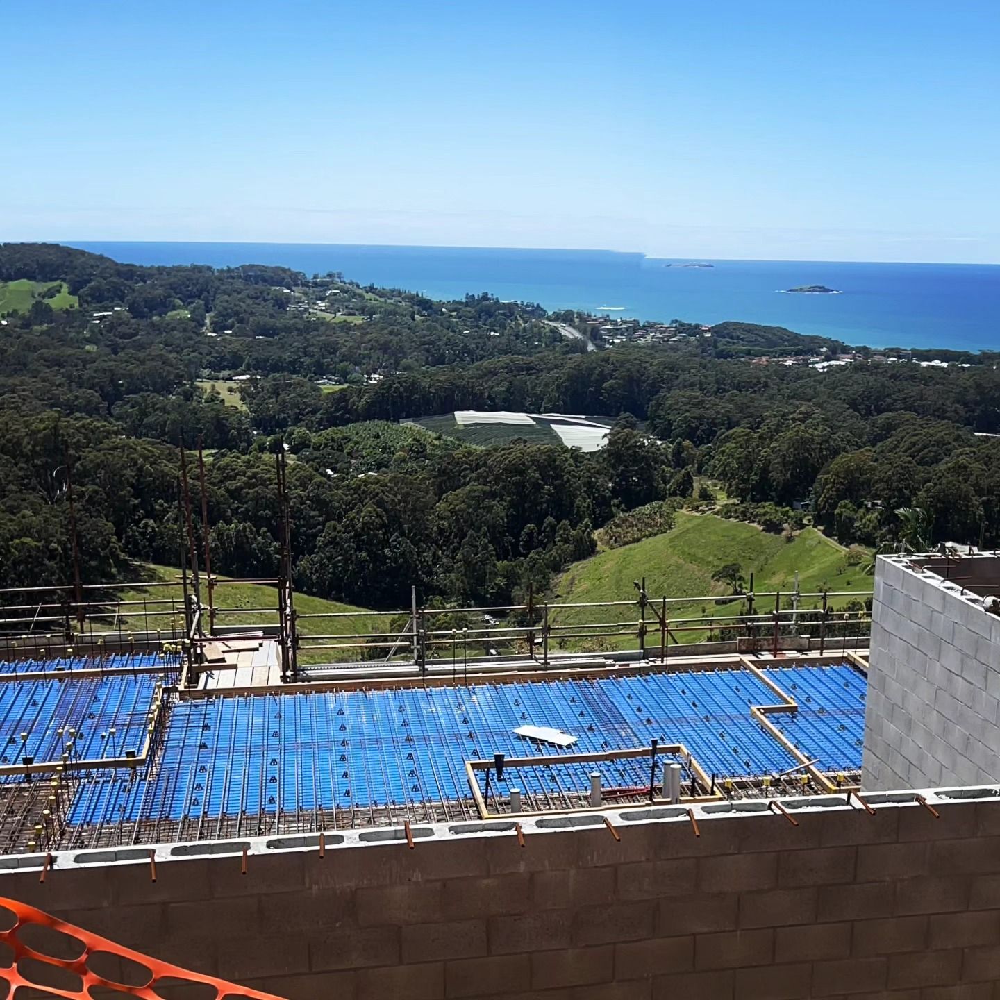 Large Building Under Construction With Scaffolding Around It
