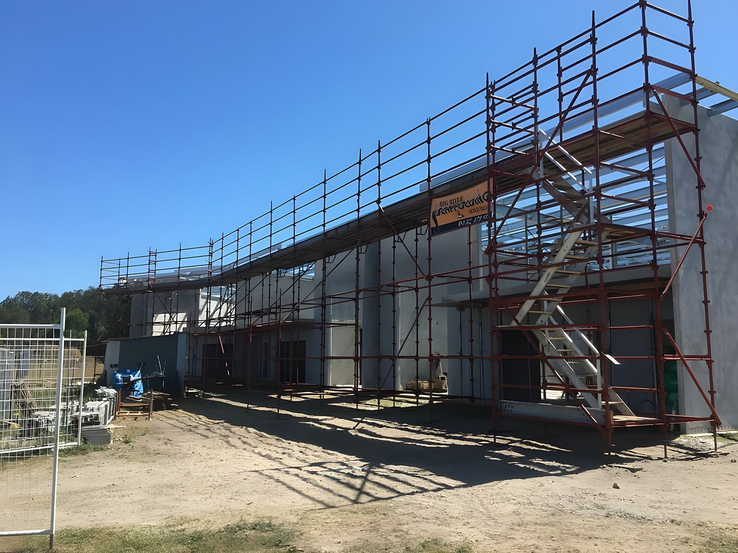 Scaffolding System Installed Along Commercial Building Construction Site