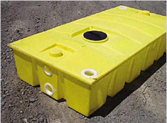 A yellow plastic container is sitting on the ground