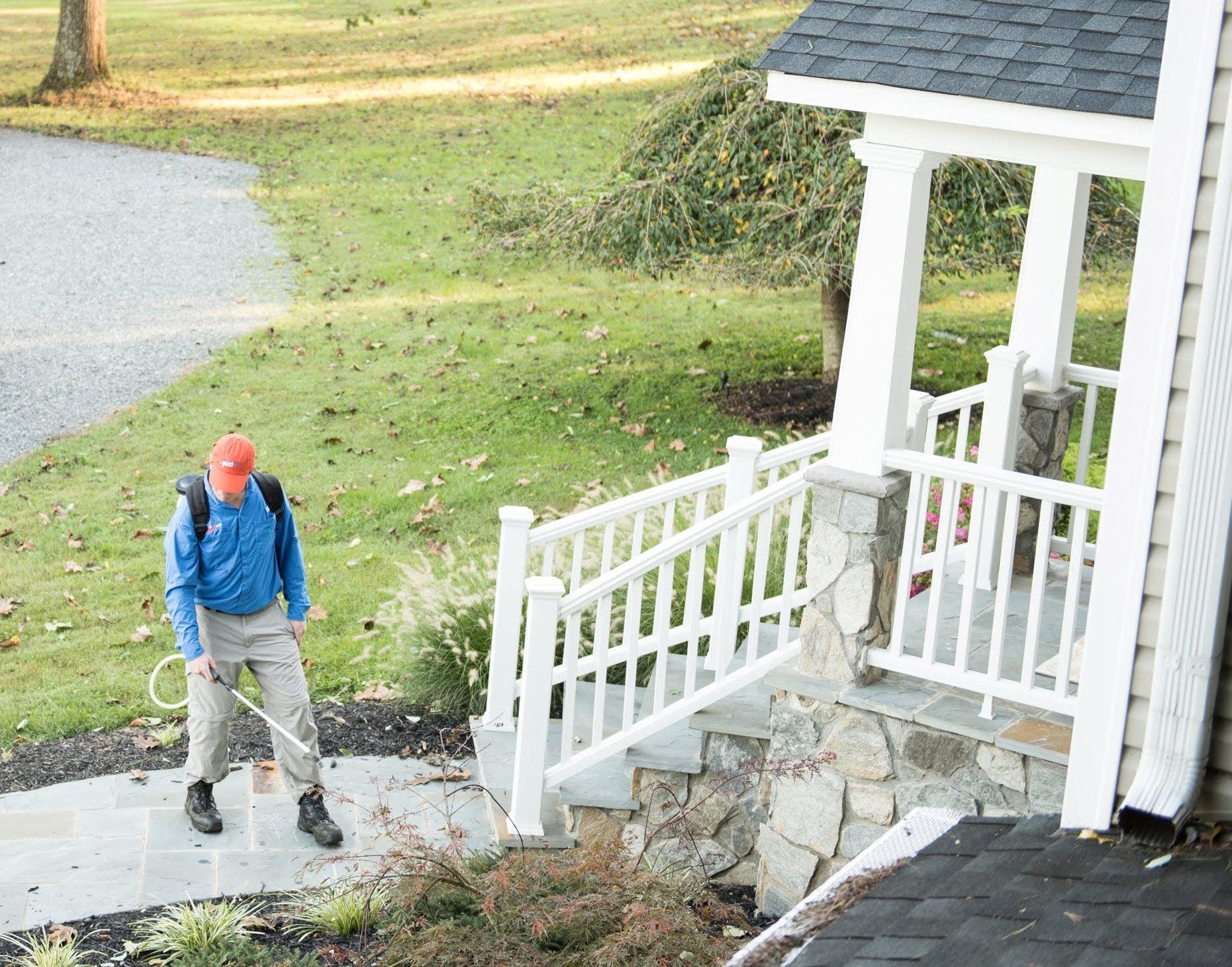 Male Worker Spraying Pesticide On Cabinet — North Fort Myers, FL — My Pest Friend Male Worker Spraying Pesticide On Cabinet — North Fort Myers, FL — My Pest Friend