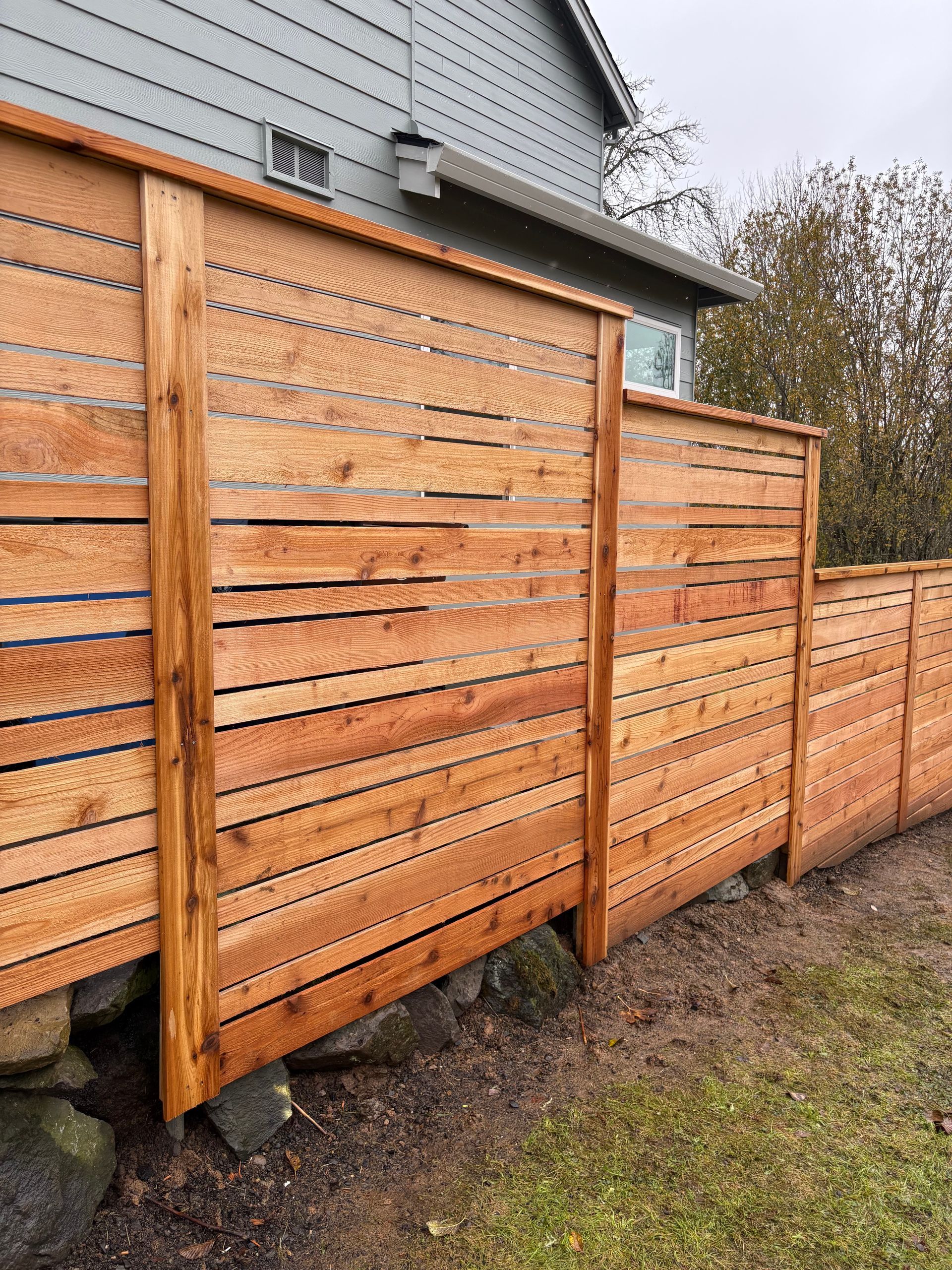 An aerial view of a house under construction with a truck parked in front of it.