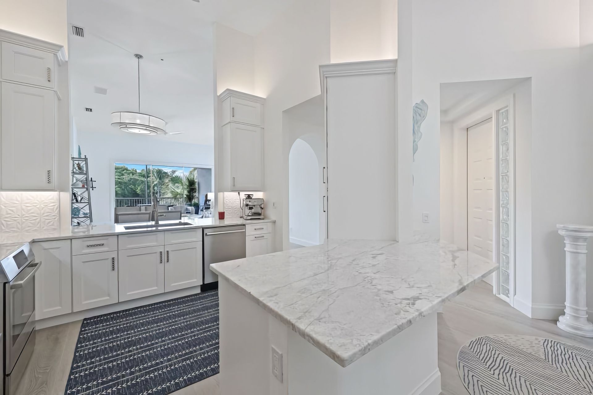 There is a large island in the middle of the kitchen.