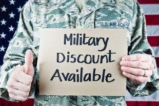 Air Force member holding a sign,