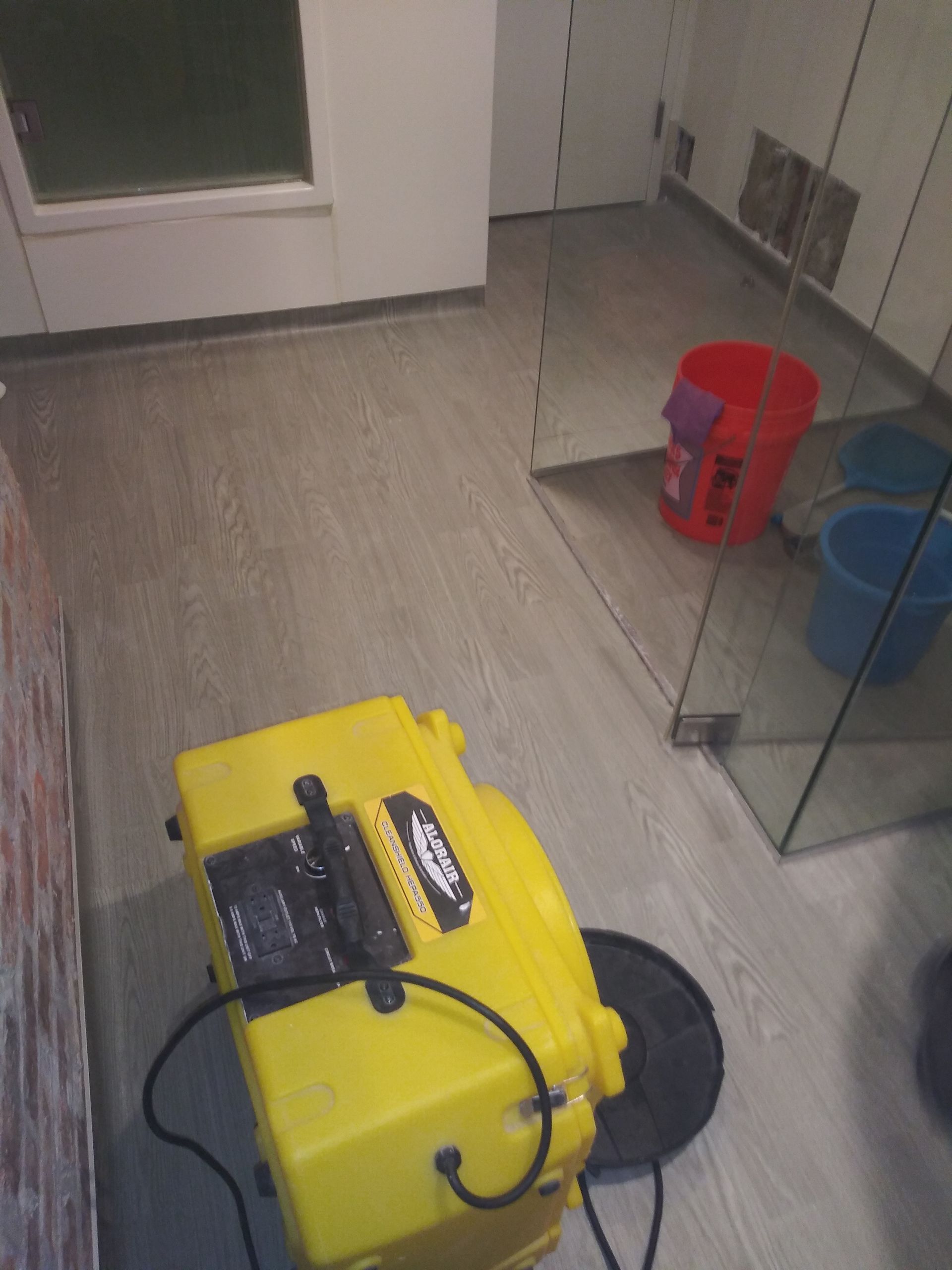 A yellow box is sitting on the floor in a room