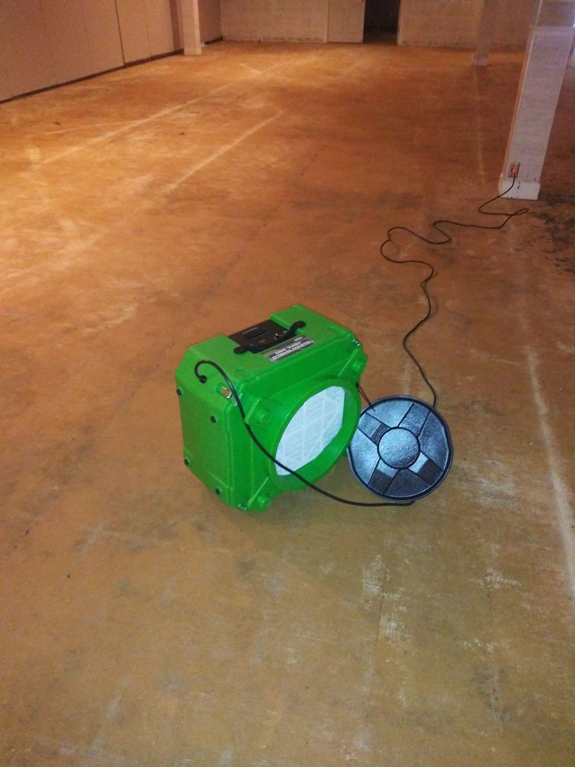 A green box with a fan attached to it