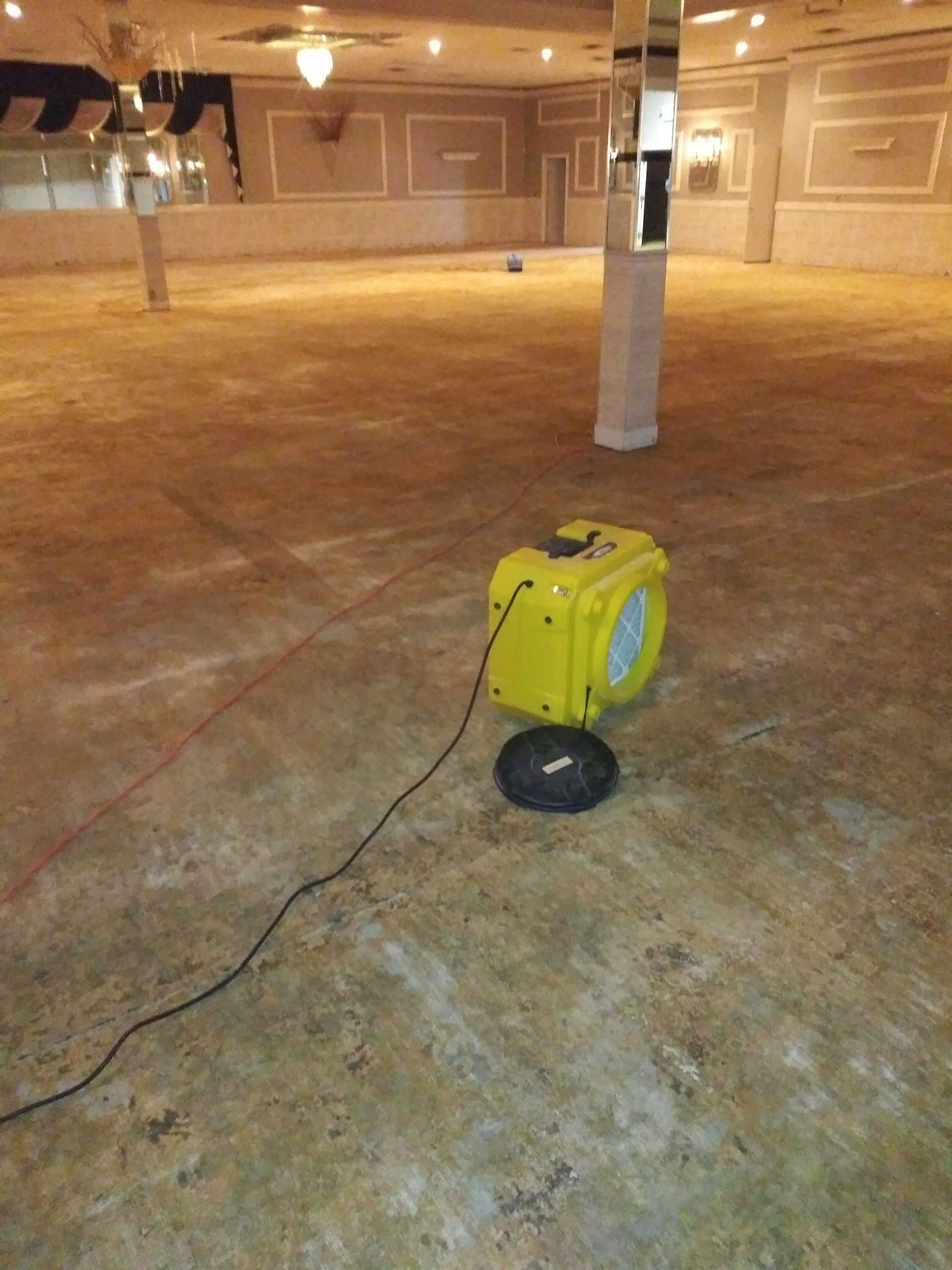 An empty room with a yellow box on the floor